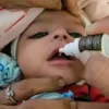 baby receiving Suvarnaprashana